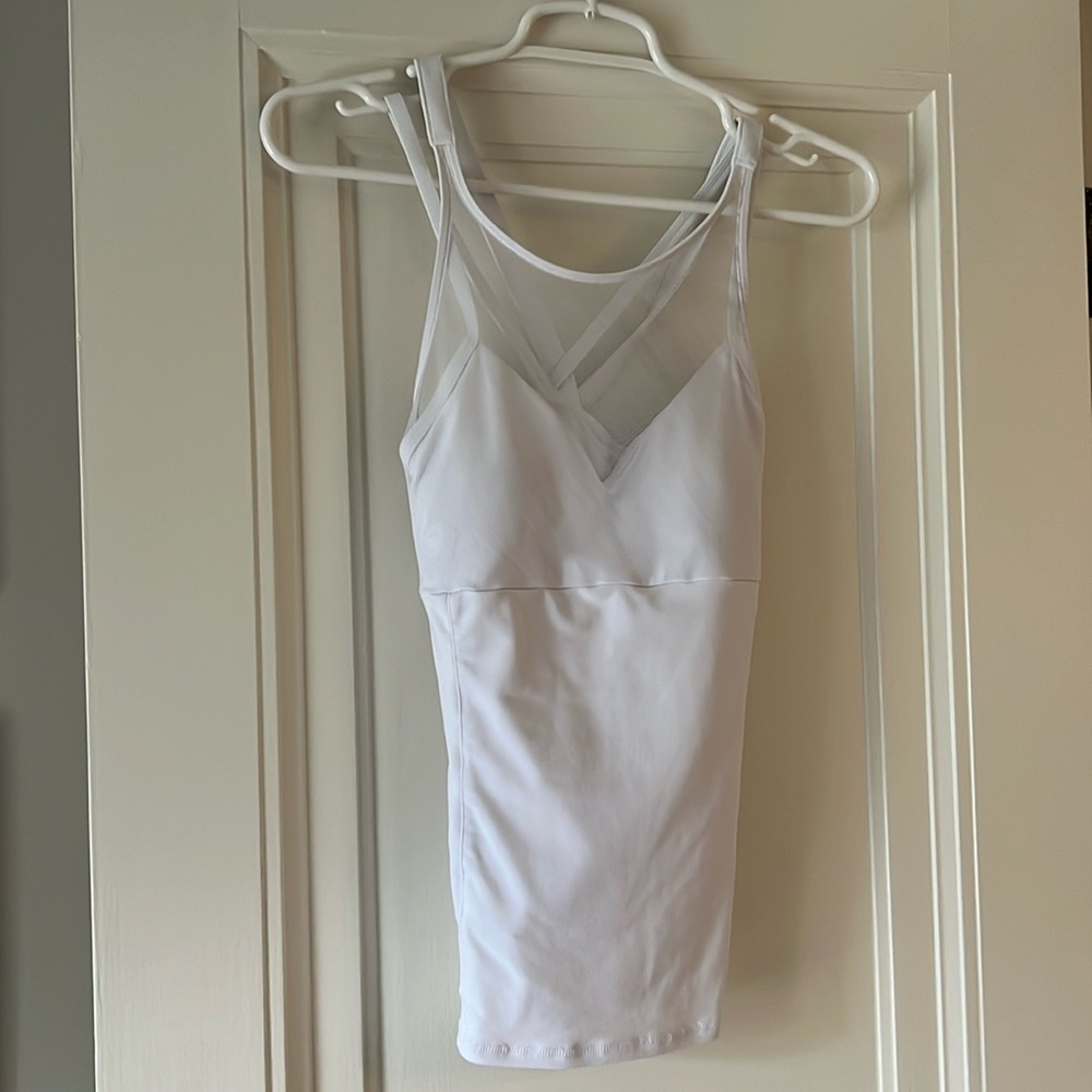 White Alo tank with cross cross straps and sheer bodice